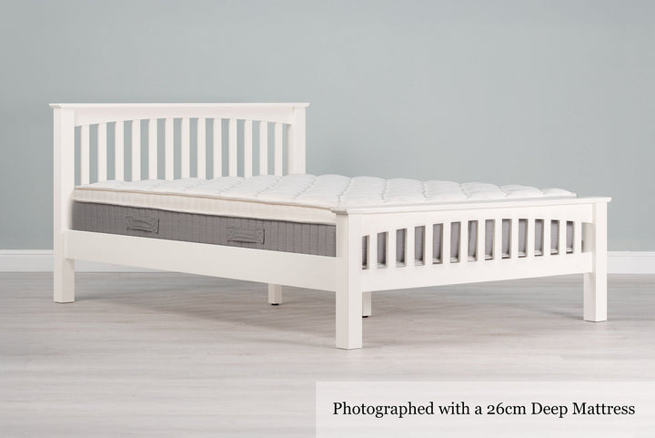 Side view of the Boston Soft White 6ft Super King Size bed frame shown with mattress.