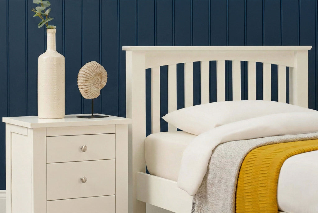 Detailed side view of Boston Soft White Solid Wood 3ft Single Bed Frame with white bedding and bedside table