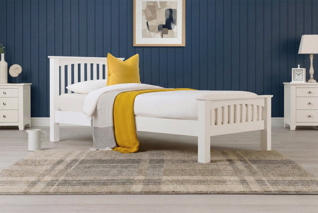 Boston Soft White Solid Wood 3ft Single Bed Frame side view with white bedding, mustard throw and yellow accent pillow