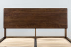 Mayfair solid walnut double bed headboard and sprung slatted base without a mattress, front close-up