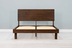 Mayfair solid walnut double bed frame with square legs and no mattress, front view from the foot of the bed