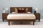 Mayfair solid walnut double bed frame with square legs, front view from the foot of the bed with matching walnut bedside tables