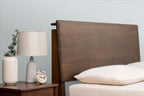 Mayfair solid walnut double bed headboard at its medium height setting, beside a matching walnut bedside table