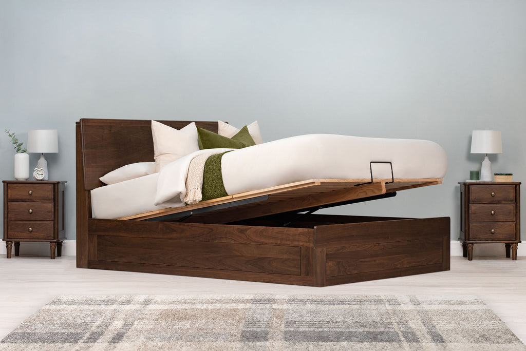 Mayfair solid walnut double ottoman bed frame with the mattress base partially raised to open the under-bed storage