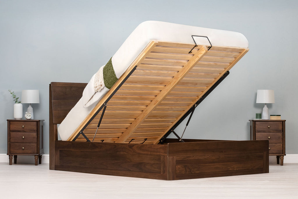 Mayfair solid walnut king size ottoman bed frame with the mattress base fully raised, showing the slatted base and gas struts