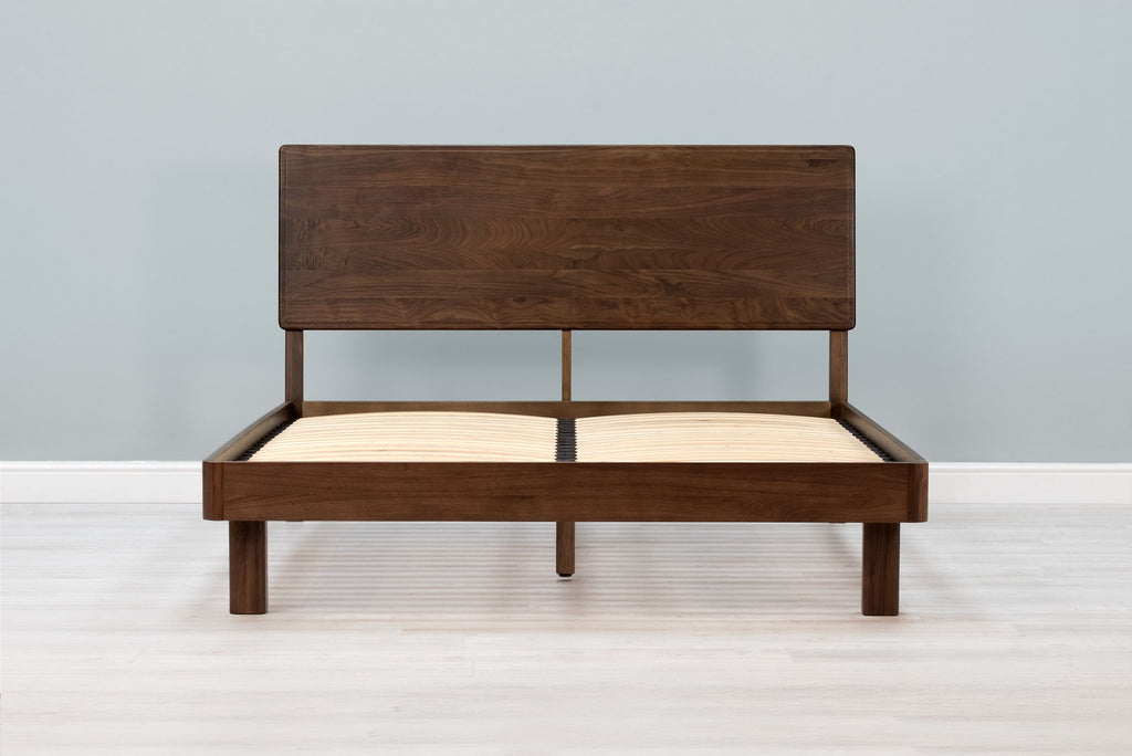Mayfair solid walnut super king bed frame with square legs and no mattress, front view from the foot of the bed