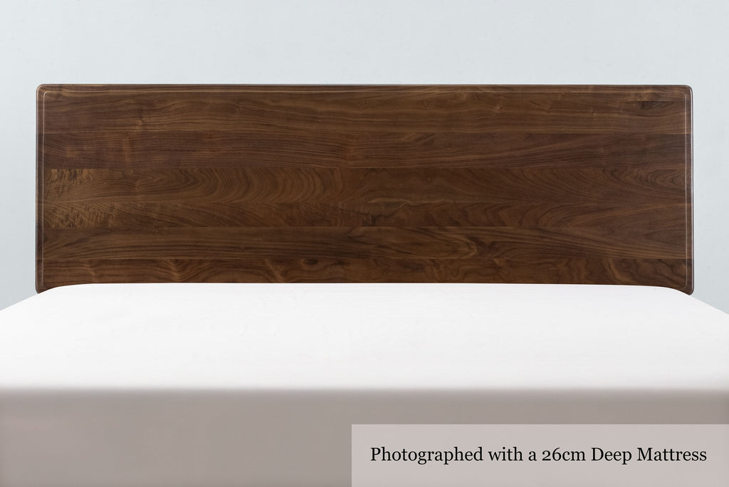 Mayfair solid walnut super king bed headboard, front close-up with a 26cm deep mattress and no bedding