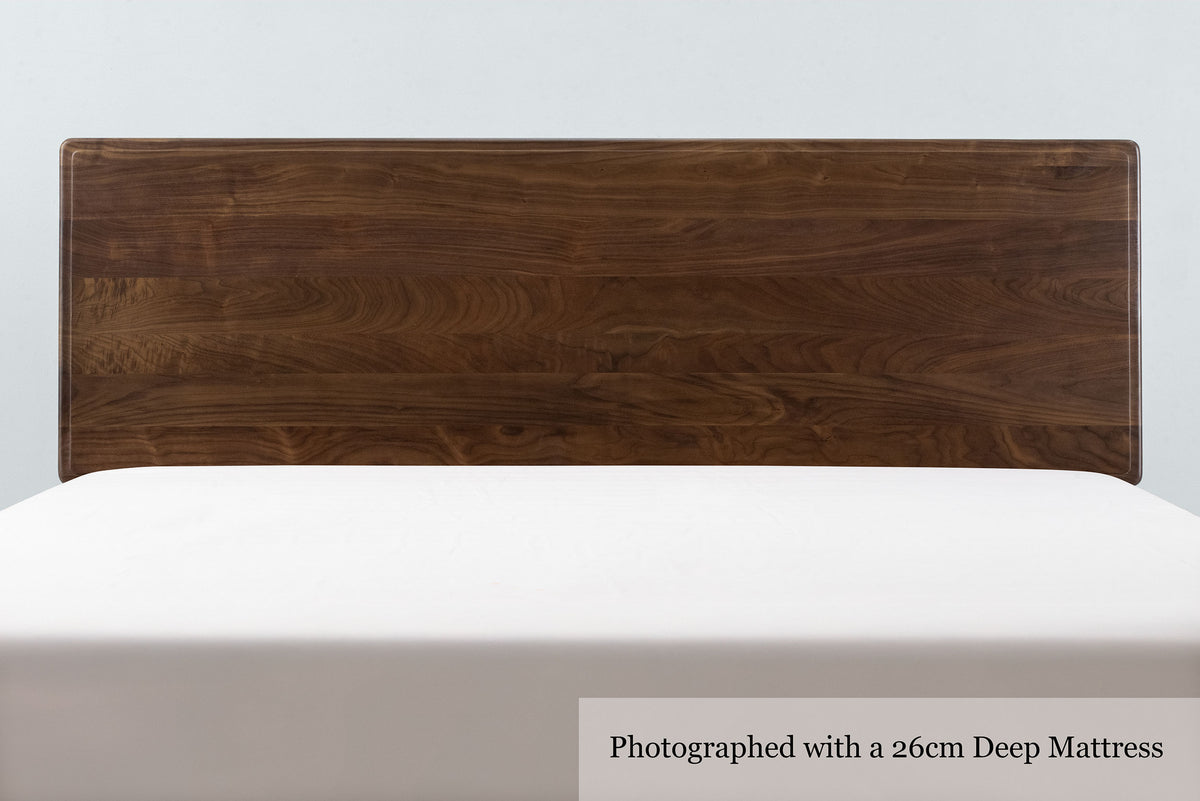 Mayfair solid walnut super king bed headboard, front close-up with a 26cm deep mattress and no bedding