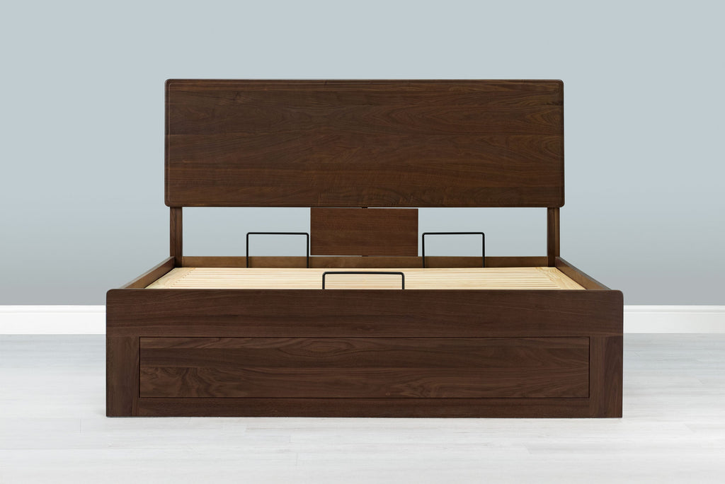 Mayfair solid walnut super king ottoman bed frame without a mattress, front view from the foot of the bed