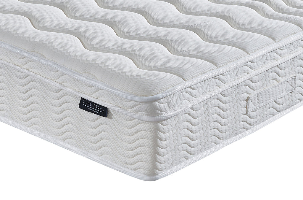 The Flow Drift Hybrid 2000 mattress side panel with quilted finish and brand label detail