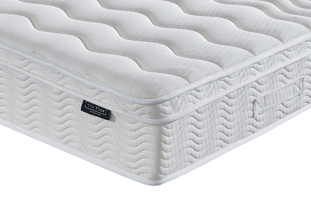 The Flow Drift Hybrid 2000 mattress side panel with quilted finish and brand label detail