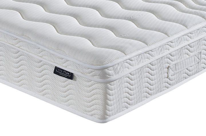 The Flow Drift Hybrid 2000 mattress side panel with quilted finish and brand label detail