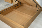 Wilmore solid natural oak double ottoman bed storage area with both removable plywood base panels in place
