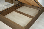 Wilmore solid rustic oak super king ottoman bed storage area with the removable base panels taken out, showing the floor beneath